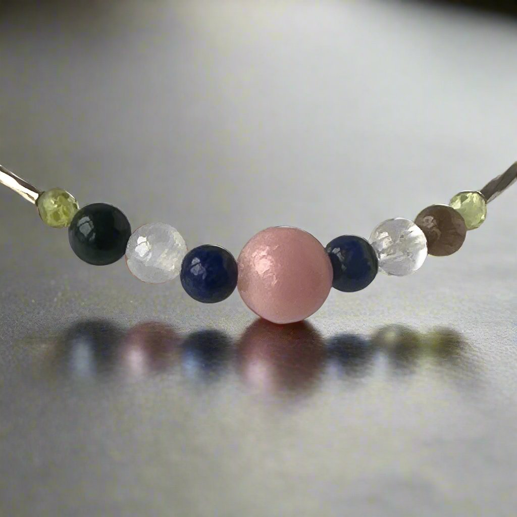Libra Birthstone Healing Crystal bracelet for Calm & Stress relief showing Pink Opal, Peridot, Lapis Lazuli, Yellow Tiger’s Eye and Clear Quartz
