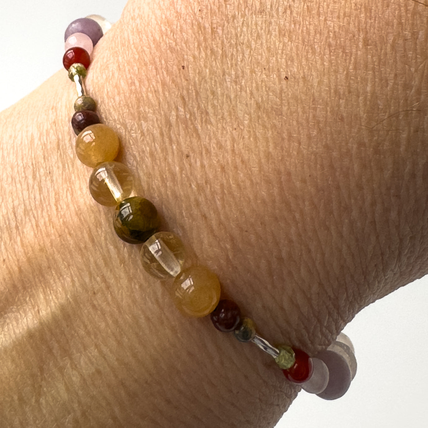 Libra Healing Crystal bracelet for Willpower on wrist showing Tiger’s Eye, Citrine, Carnelian, Brecciated Jasper and Leopardskin Jasper