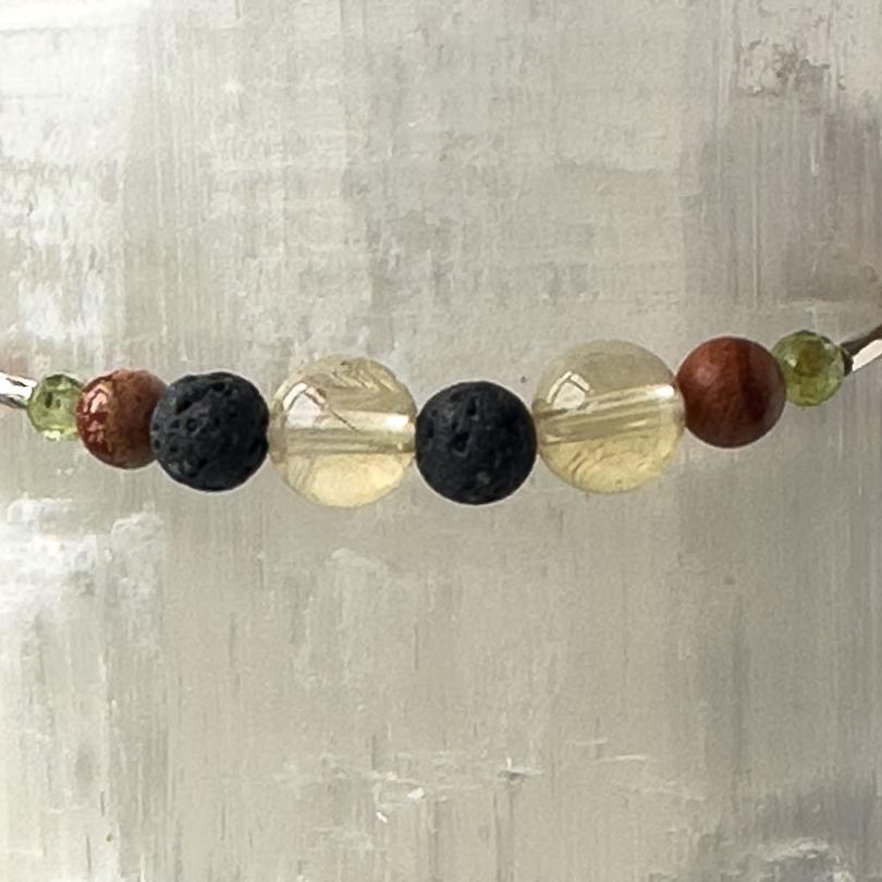 Libra Birthstone Healing Crystal bracelet for Determination & Willpower showing Citrine, Peridot, Brecciated Jasper and Lava Stone