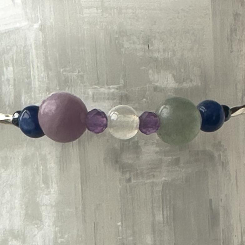 Pisces Birthstone Healing Crystal bracelet for Determination & Willpower showing Amethyst, Lepidolite, Hematite, Rainbow Fluorite, Sodalite and Selenite