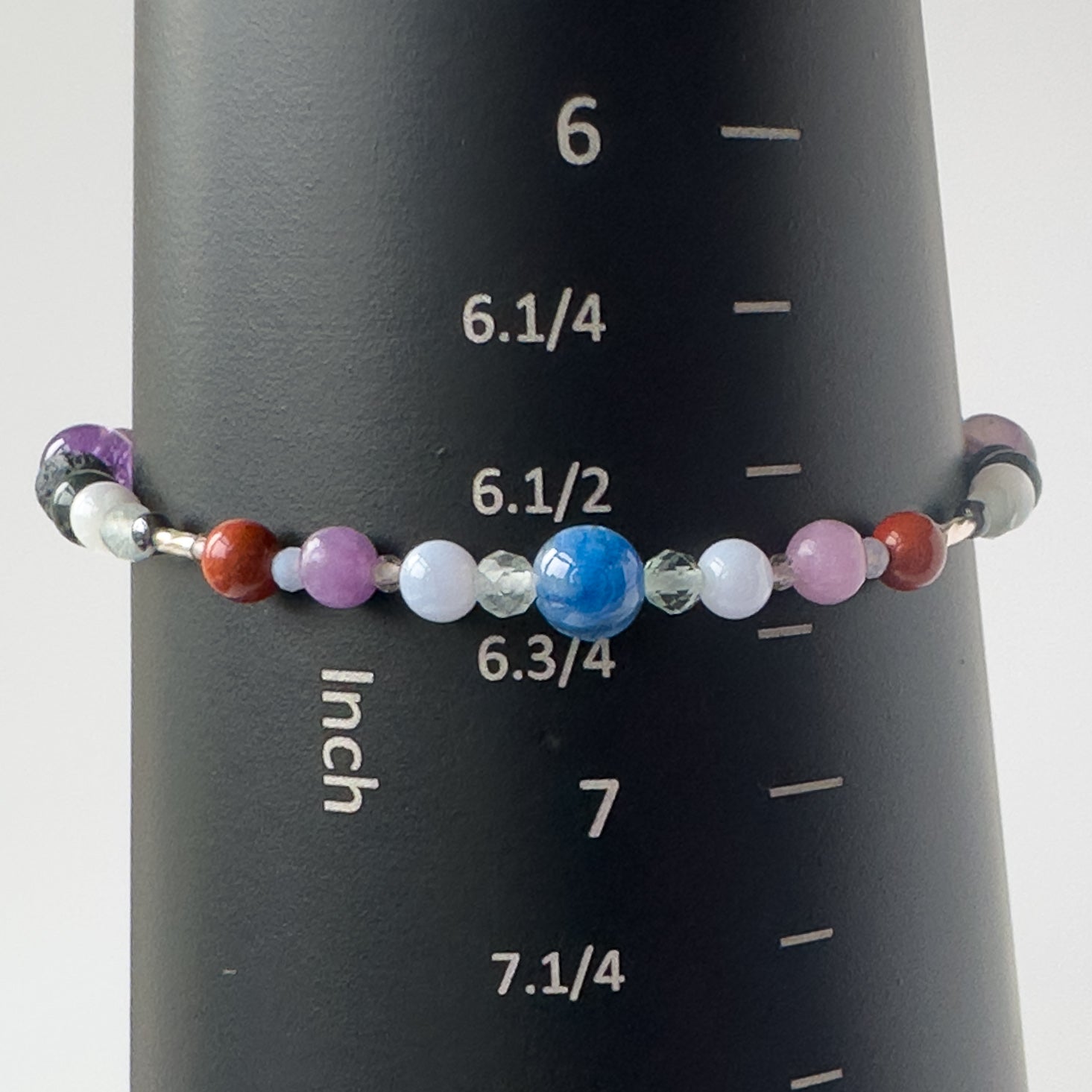 Pisces Birthstone Healing Crystal bracelet for Calm & Stress bracelet on mandrel showing size of approx 6.5 inches