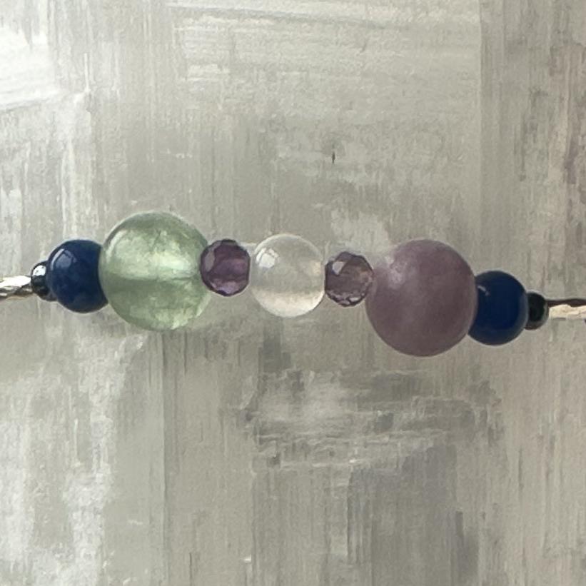 Pisces Birthstone Healing Crystal bracelet for Determination & Willpower showing Amethyst, Lepidolite, Hematite, Rainbow Fluorite, Sodalite and Selenite