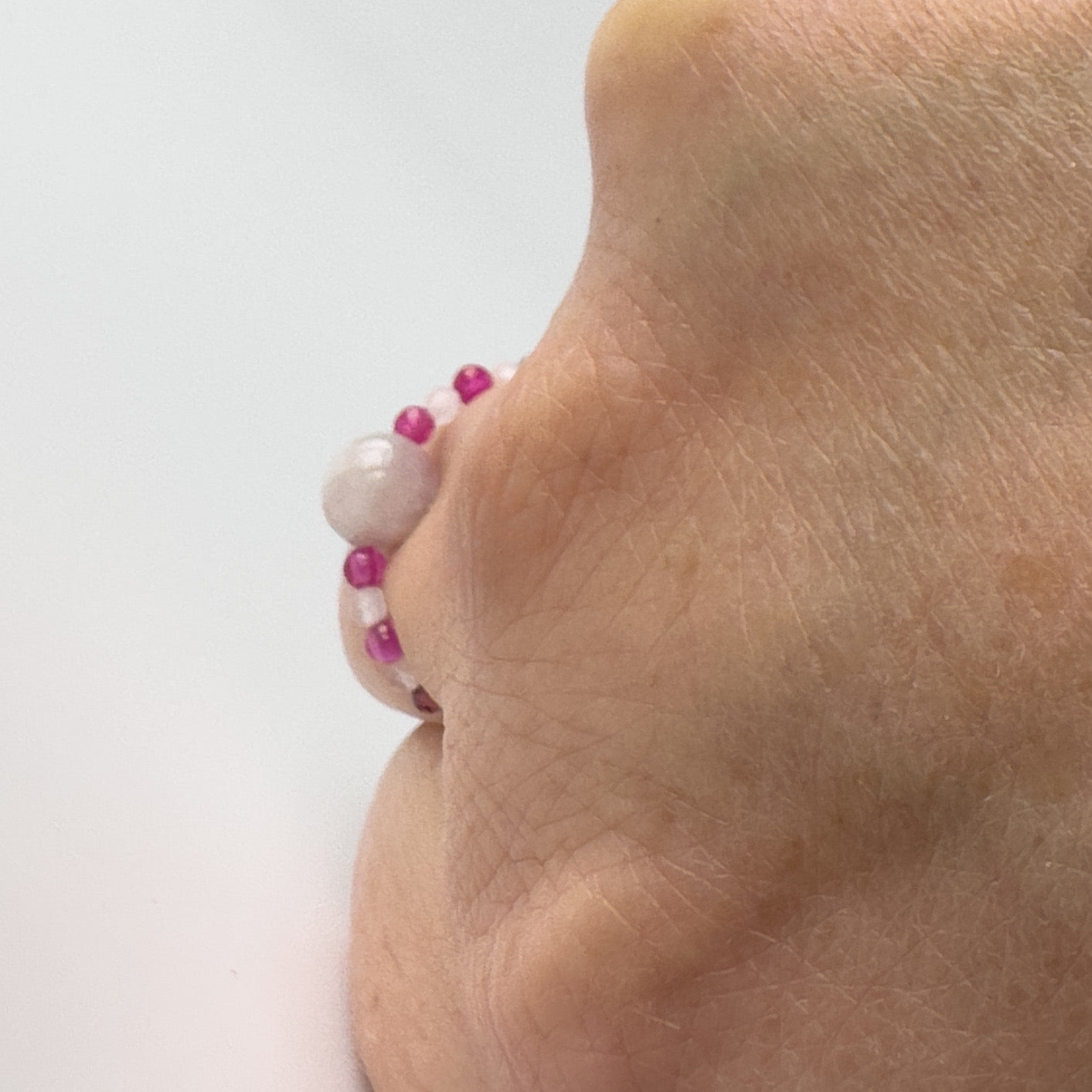 Profile view of Leo Birthstone Healing Crystal ring for Love and Compassion on finger