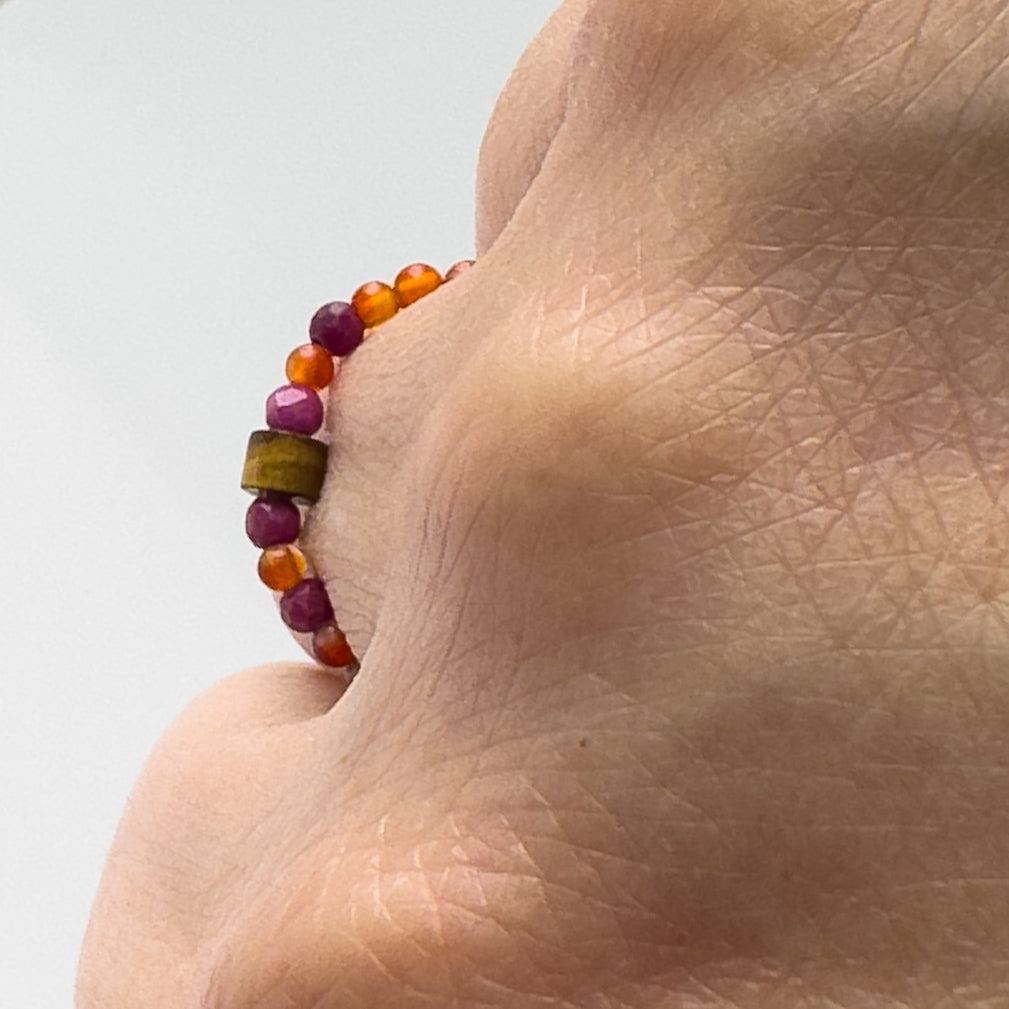 Profile view of Libra Birthstone Healing Crystal ring for Strength and Courage on finger