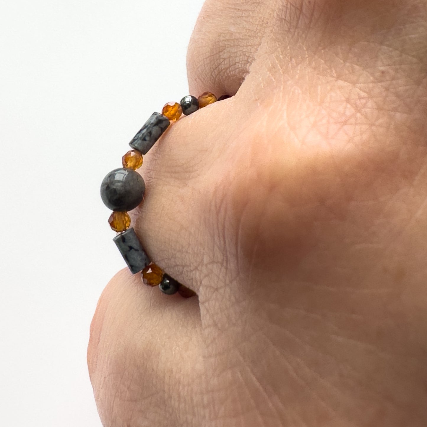 Profile view of Scorpio birthstone Healing Crystal ring for Strength and Courage on finger