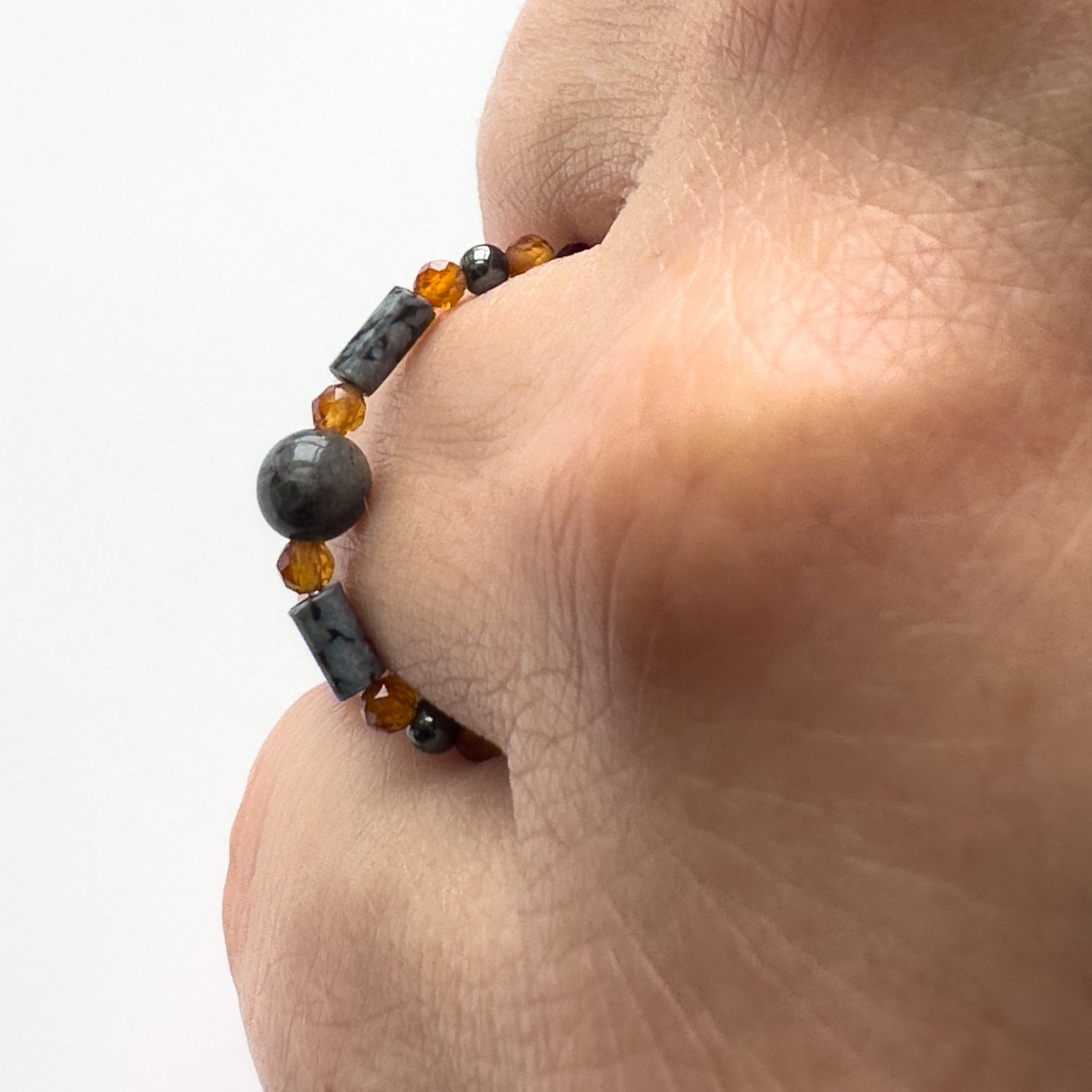 Profile view of Scorpio birthstone Healing Crystal ring for Strength and Courage on finger