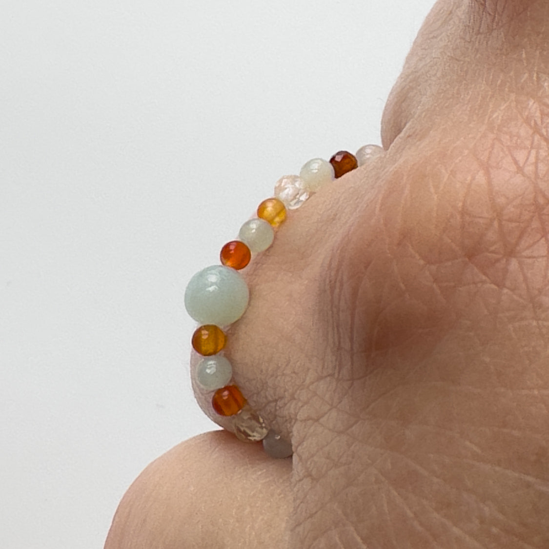 Profile view of Virgo birthstone Healing Crystal ring for Strength and  Courage on finger