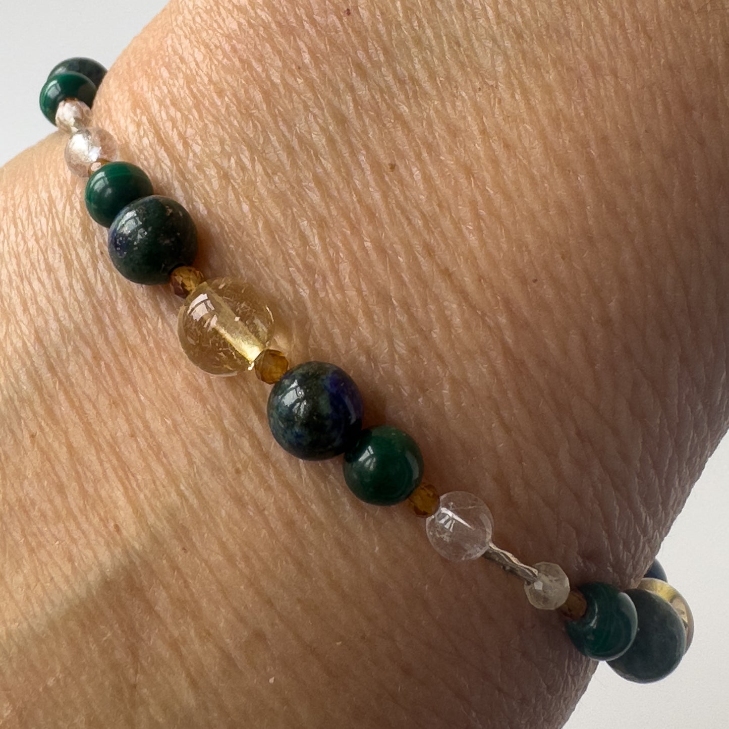Sagittarius Healing Crystal bracelet for Love on wrist showing Citrine, Azurite, Garnet, malachite and Clear Quartz