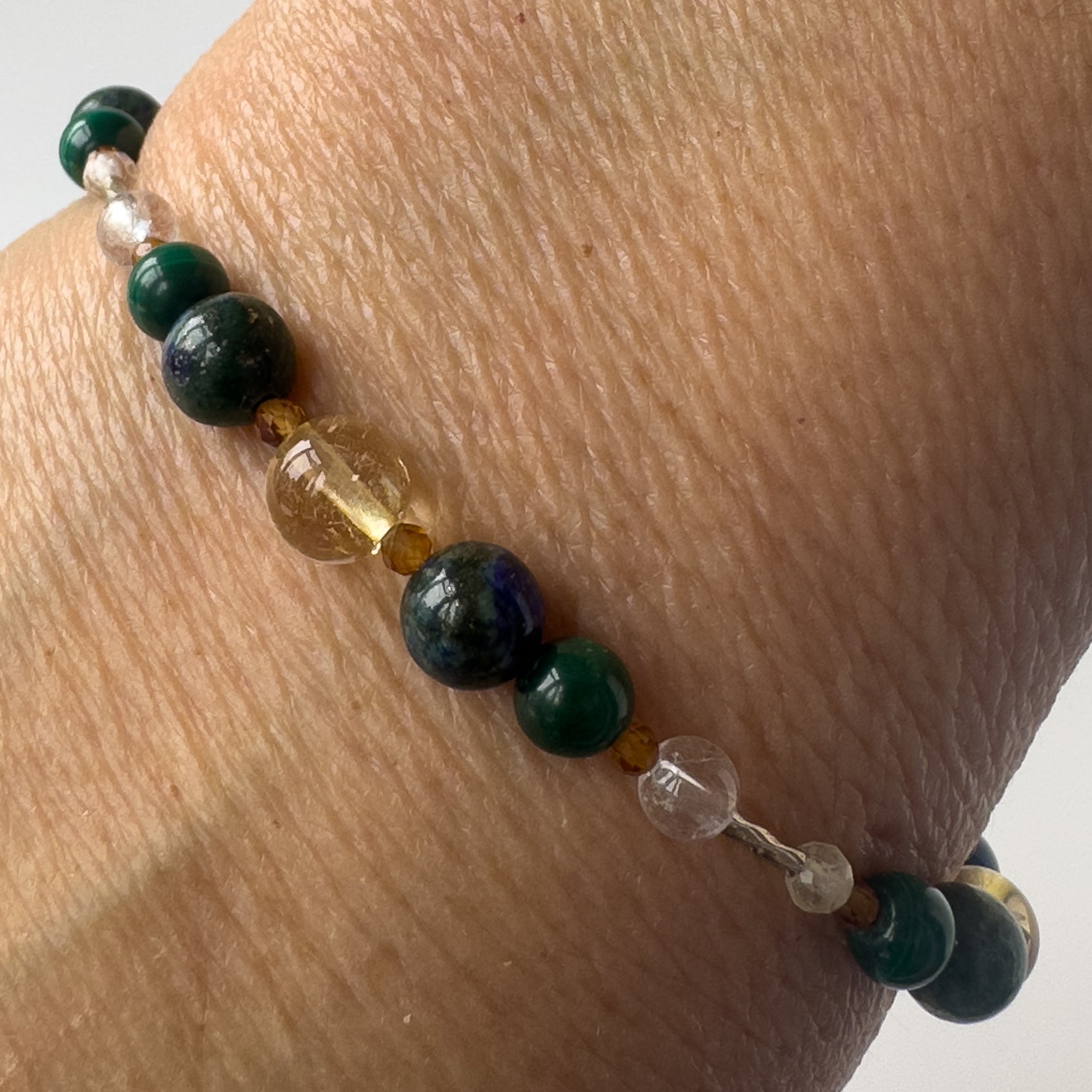 Sagittarius Healing Crystal bracelet for Love on wrist showing Citrine, Azurite, Garnet, malachite and Clear Quartz