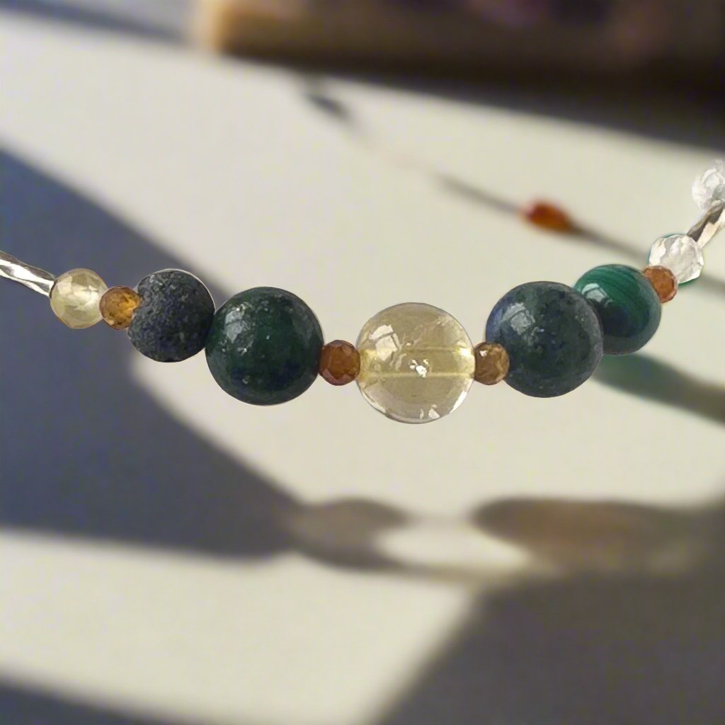 Sagittarius Birthstone Healing Crystal bracelet for Love and Compassion showing Citrine, Azurite, Garnet, malachite and Lava Stone