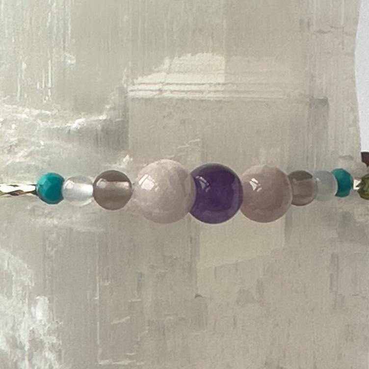 Scorpio Birthstone Healing Crystal bracelet for Calm & Anxiety Relief showing Turquoise, Blue Lace Agate, Amethyst, Smoky Quartz, Kunzite and Selenite