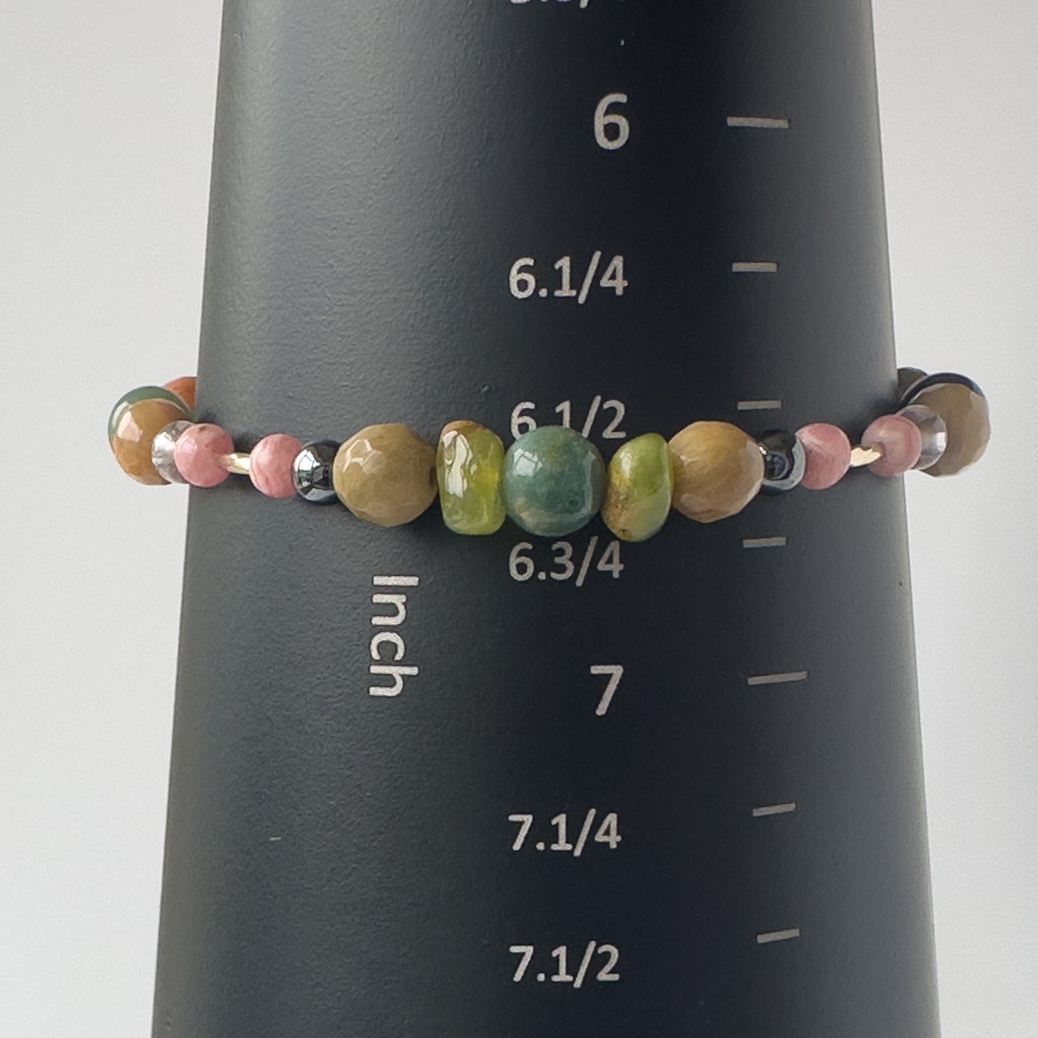 Scorpio birthstone Healing Crystal bracelet for Love and Compassion on mandrel showing size as approx 6.5 inches
