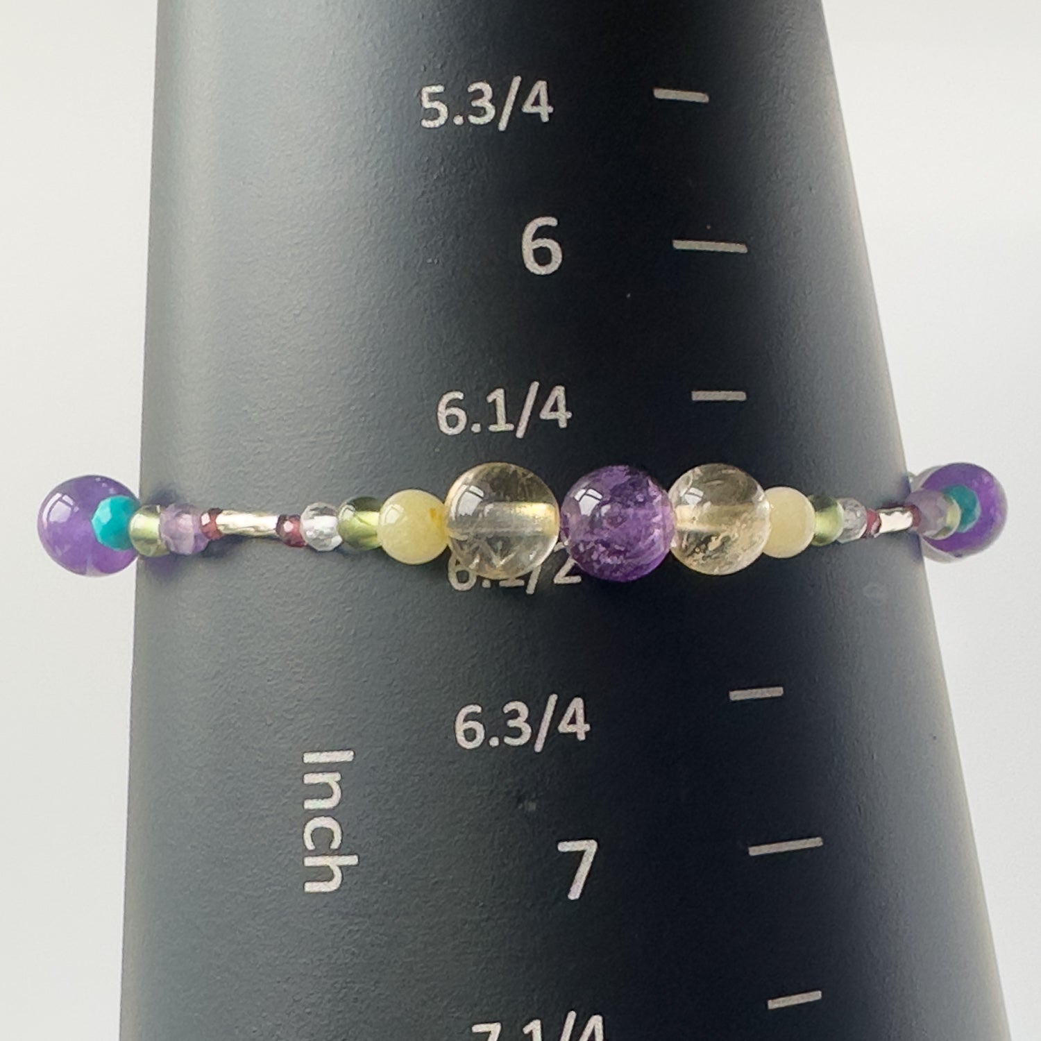 Scorpio Birthstone Healing Crystal bracelet for Determination & Willpower on mandrel showing size as 6.5 inches