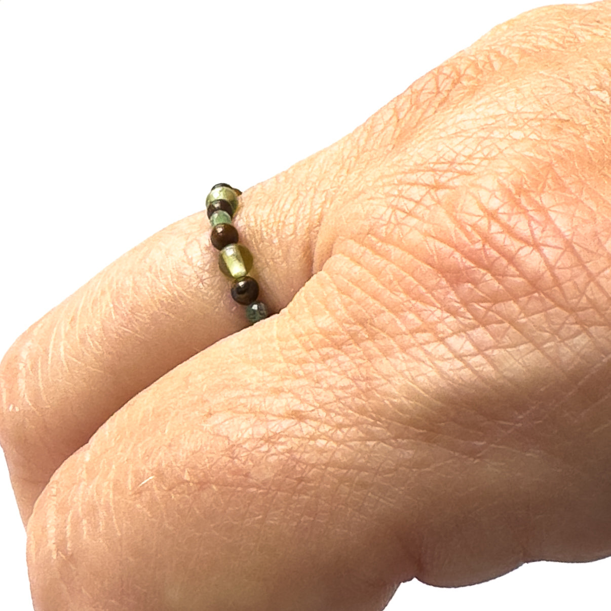 Side view of Love And Compassion Healing Crystal ring for Libra, Gemini, Leo or Pisces on finger