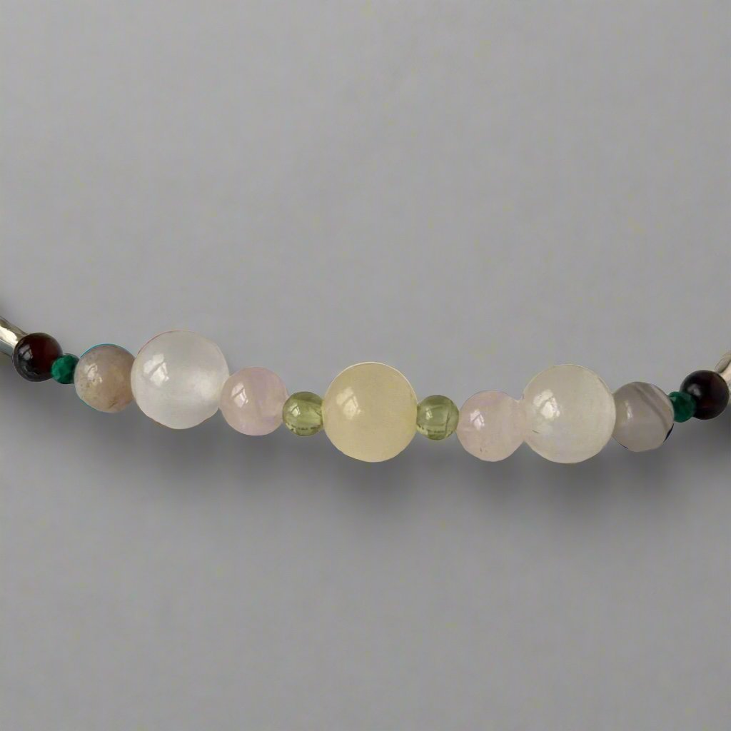 Taurus Birthstone Healing Crystal bracelet for Determination & Willpower showing Peridot, Malachite, Botswana Agate, Aragonite, Rose Quartz and Selenite