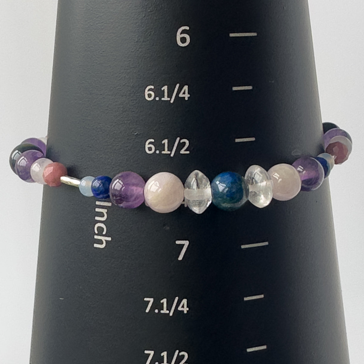 Taurus Birthstone Healing Crystal bracelet for Calm & Anxiety Relief on a mandrel showing a size of 6.7 inches