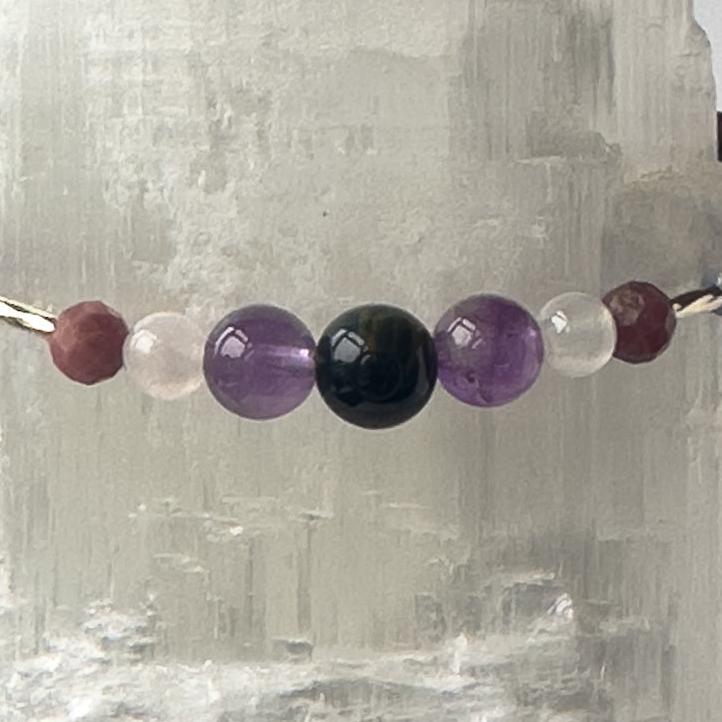 Taurus Birthstone Healing Crystal bracelet for Calm & Anxiety Relief showing Amethyst, Blue Lace Agate, Rhodonite, Kunzite and Blue Tiger’s Eye