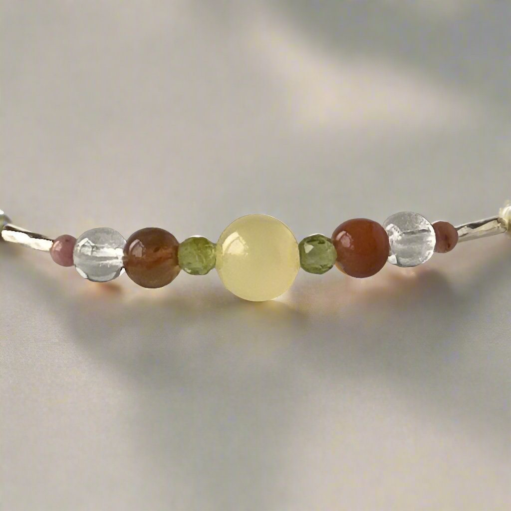 Taurus Birthstone Healing Crystal bracelet for Confidence and Self-esteem showing Aragonite, Botswana Agate, Peridot, Rhodonite and Clear Quartz