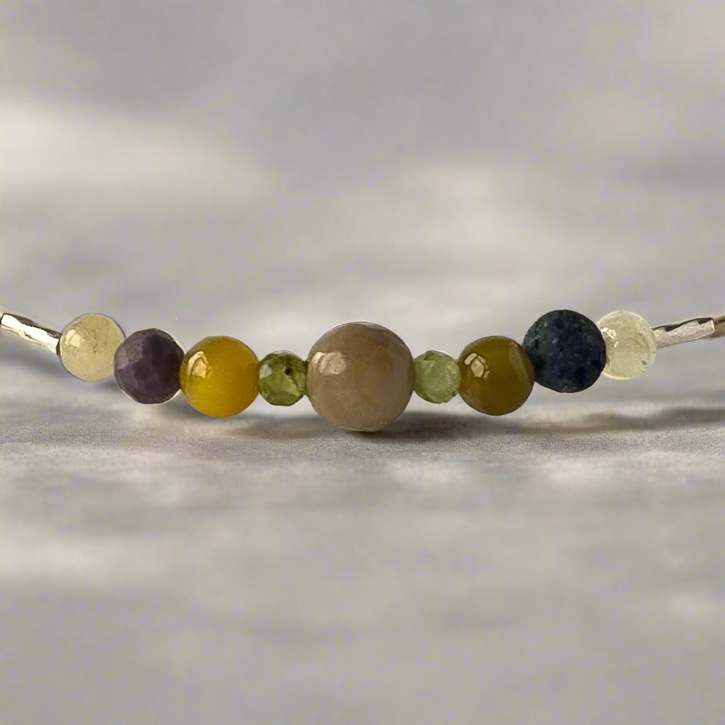 Taurus birthstone Healing Crystal bracelet for Confidence and Self-esteem showing Yellow Tiger’s Eye, Aragonite, Peridot and Rhodonite
