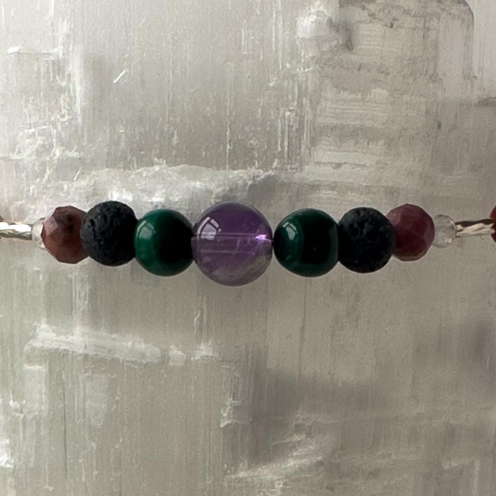 Taurus Birthstone Healing Crystal bracelet for Grief & Loss support showing Amethyst, Malachite, Rhodonite and Lava Stone