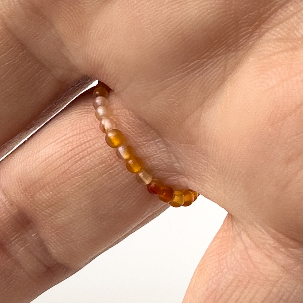 Underside view of Capricorn birthstone Healing Crystal ring for Strength and Courage on a finger