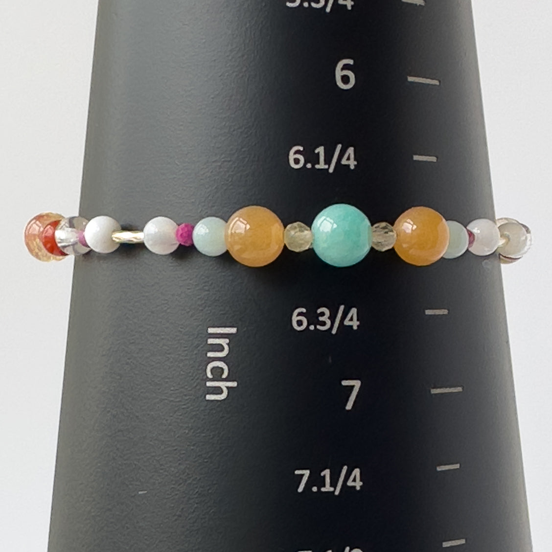Virgo Birthstone Healing Crystal bracelet for Grief & Loss support on mandrel showing size of 6.5 inches