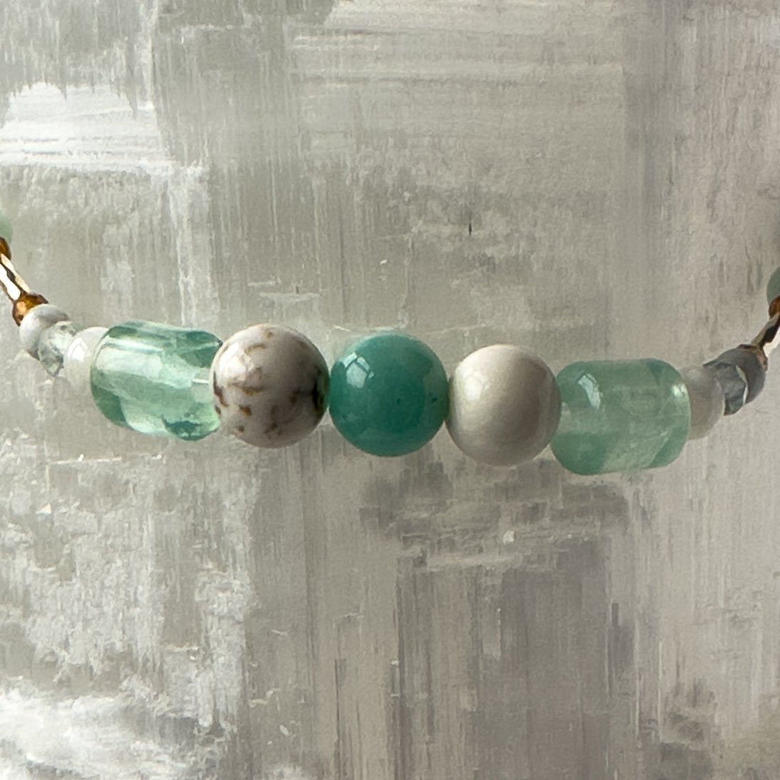 Virgo Birthstone Healing Crystal bracelet for Calm & Stress relief showing Howlite, Amazonite, Fluorite, Magnesite and Garnet