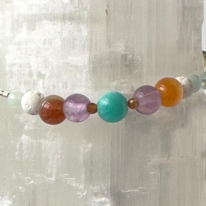 Virgo Birthstone Healing Crystal bracelet for Determination & Willpower showing Sardonyx, Rainbow Fluorite, Garnet, Amazonite and Lava Stone