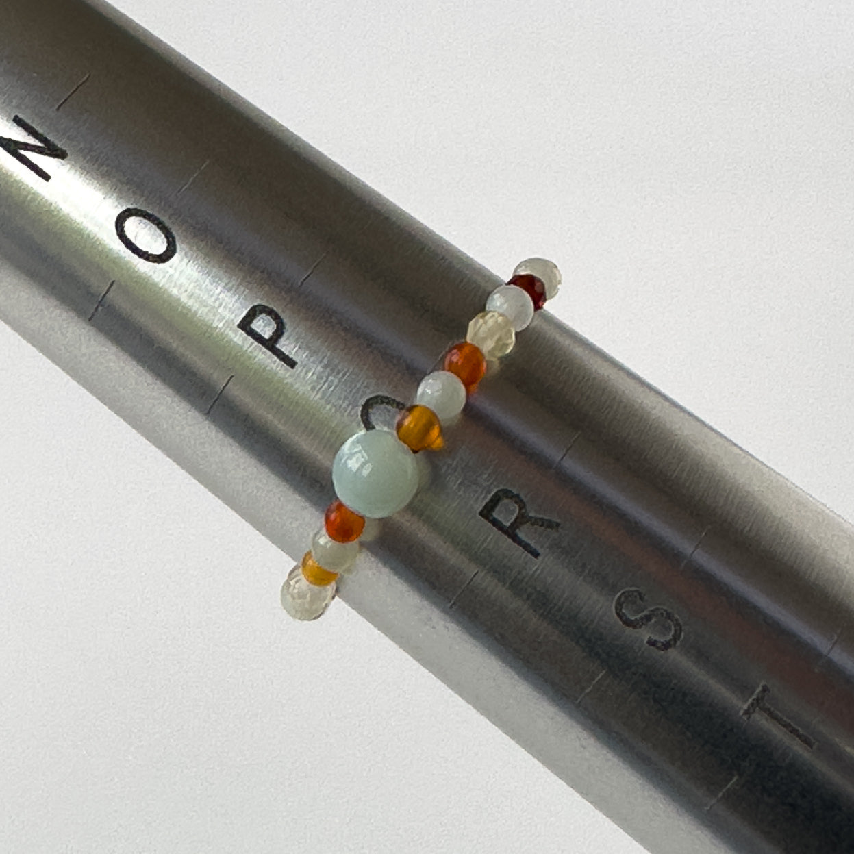 Virgo Birthstone Healing Crystal ring for Strength and Courage on mandrel showing size of Q