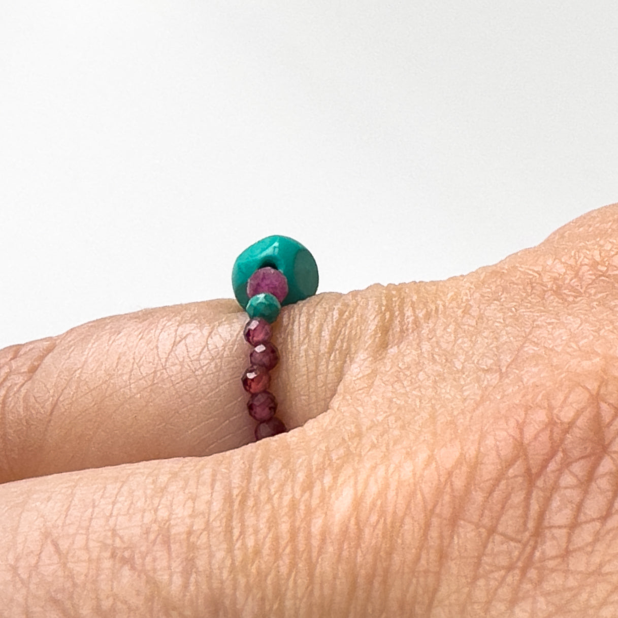 side view Courage Birthstone Healing Crystal Ring for Leo, Capricorn, Sagittarius & Scorpio on finger