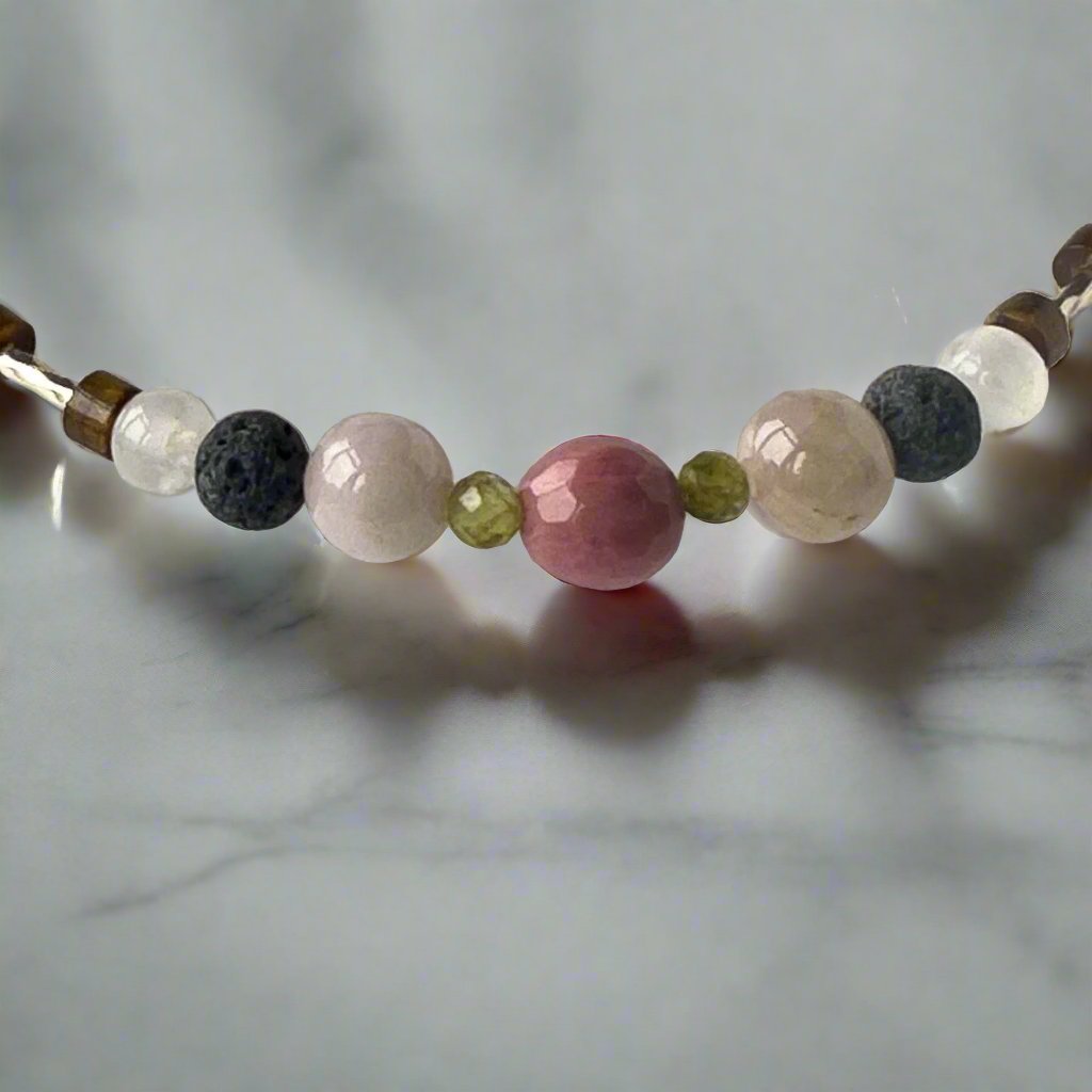 Taurus Healing Crystal bracelet for Love showing Peridot, Kunzite, Rhodonite, Tiger’s Eye, Lava Stone and Selenite