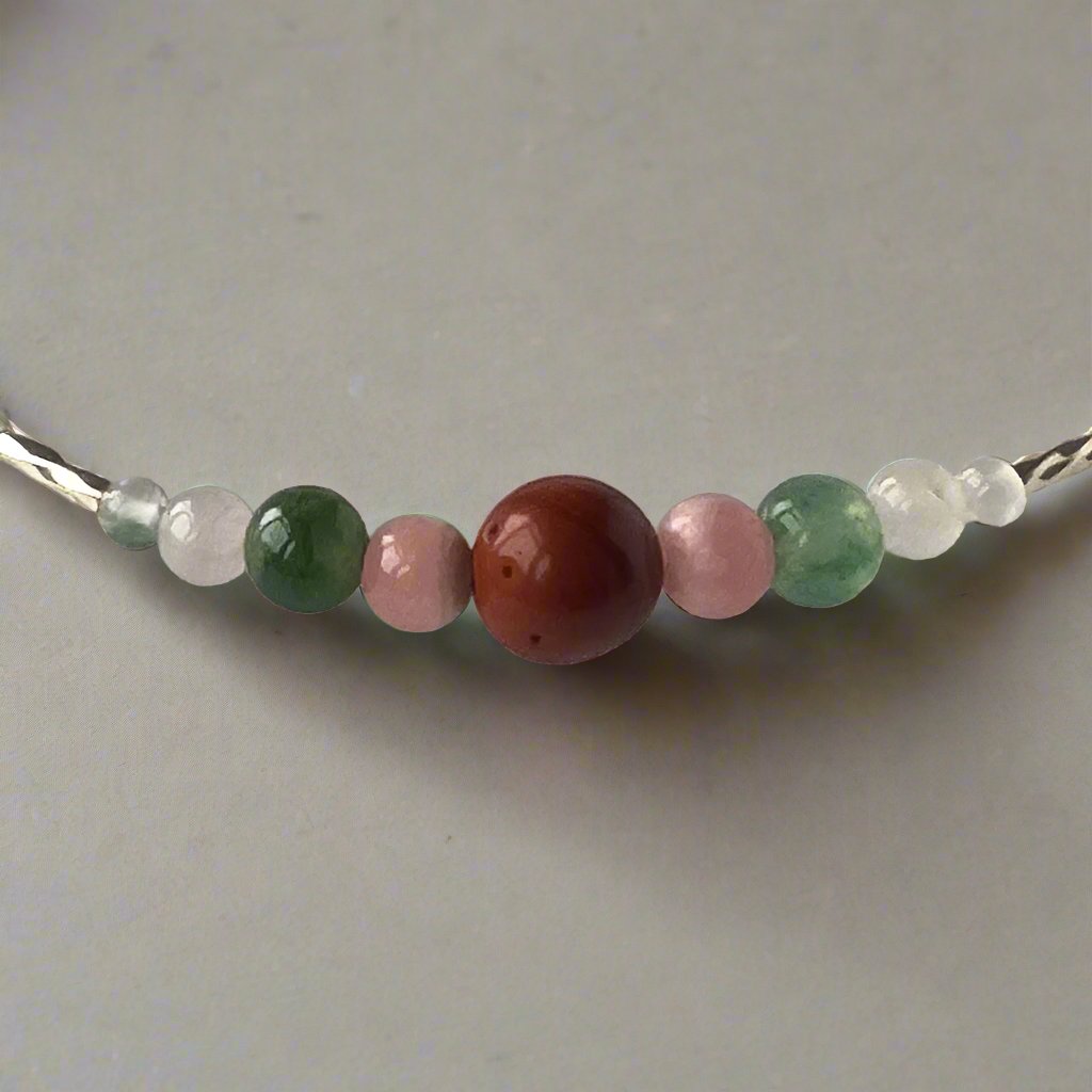 Aquarius Healing Crystal bracelet for Love Close-up of Rose Quartz, Moss Agate, Red Jasper and Rhodochrosite