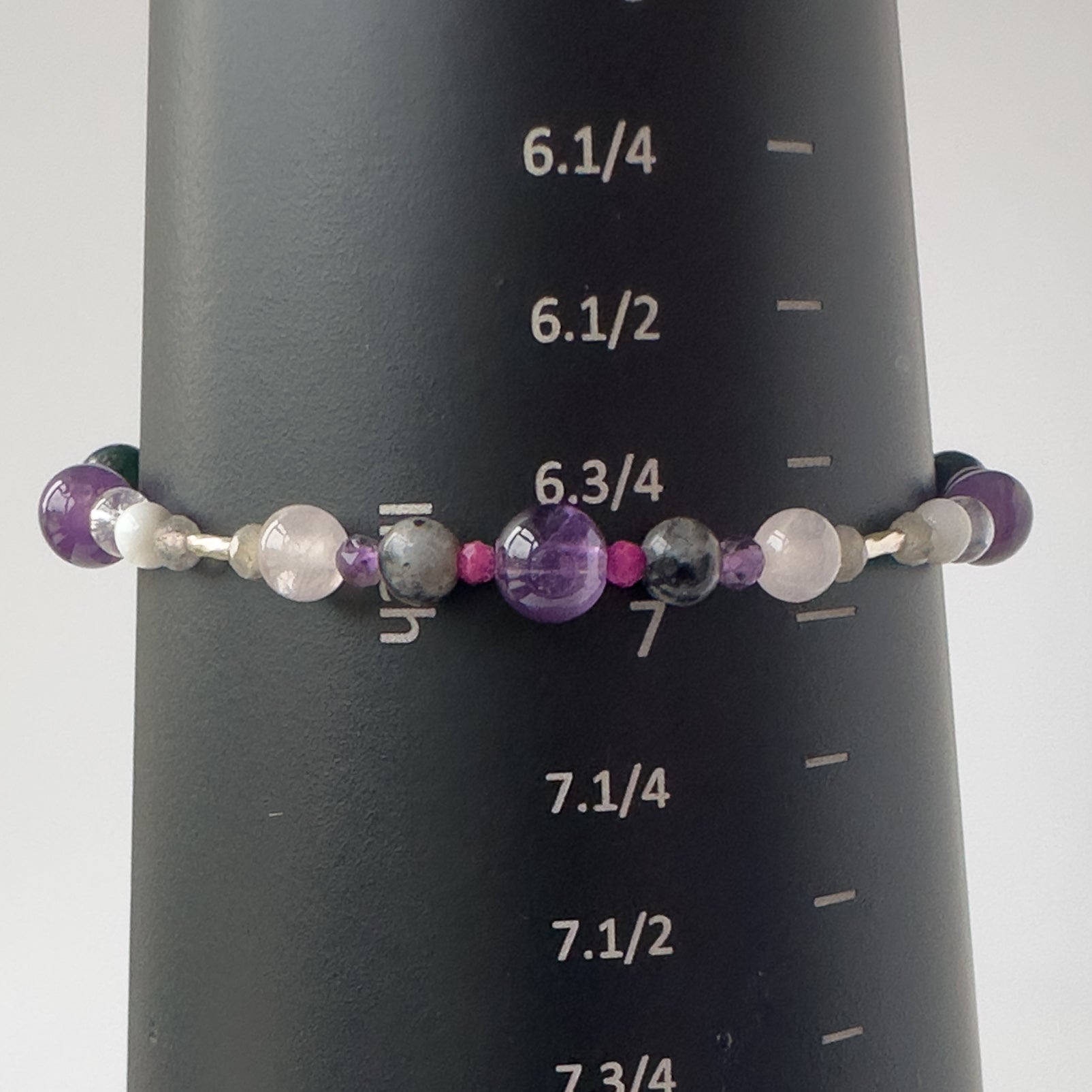 Aquarius Birthstone Healing Crystal bracelet for Grief & Loss support on mandrel showing size of approx 7 inches