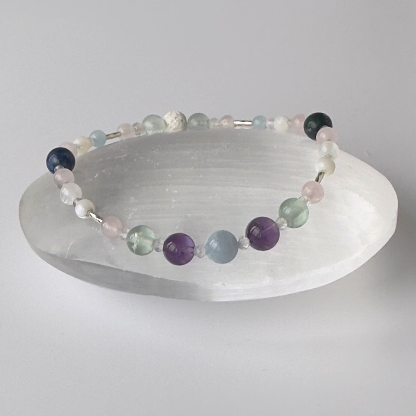 Healing crystal bracelet of Amethyst, Aquamarine, Fluorite, Moonstone, Azurite, Rose Quartz, Selenite, Clear Quartz & Lava Stone