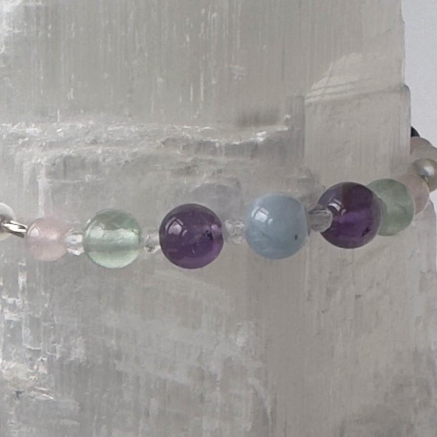 Aquarius Healing Crystal bracelet for Anxiety Close up showing Amethyst, Aquamarine, Fluorite and Rose Quartz