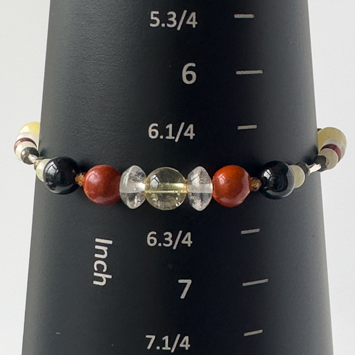 Aries Birthstone Healing Crystal bracelet for Confidence and Self-esteem on a mandrel showing a size of 6.5 inches