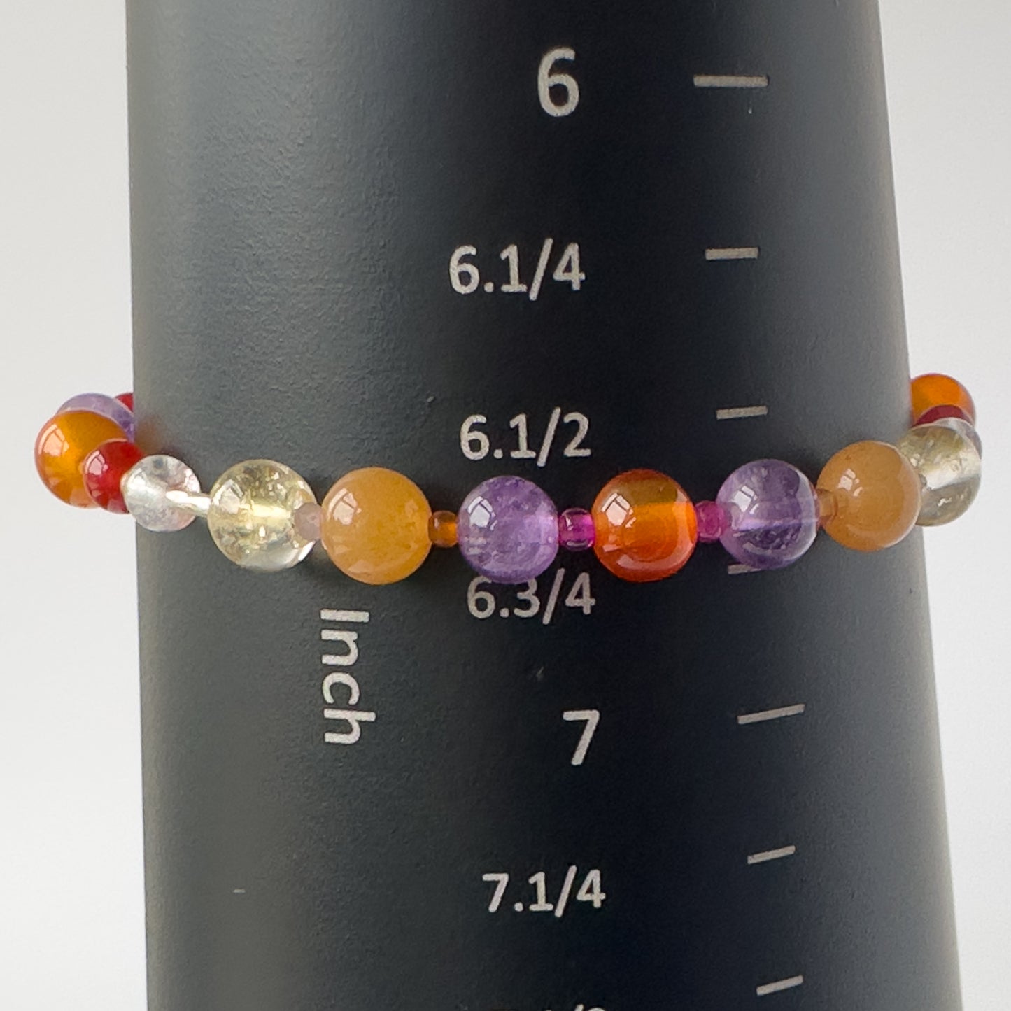 Aries Birthstone Healing Crystal bracelet for Grief & Loss support on mandrel showing a size of approx 6.75 inches
