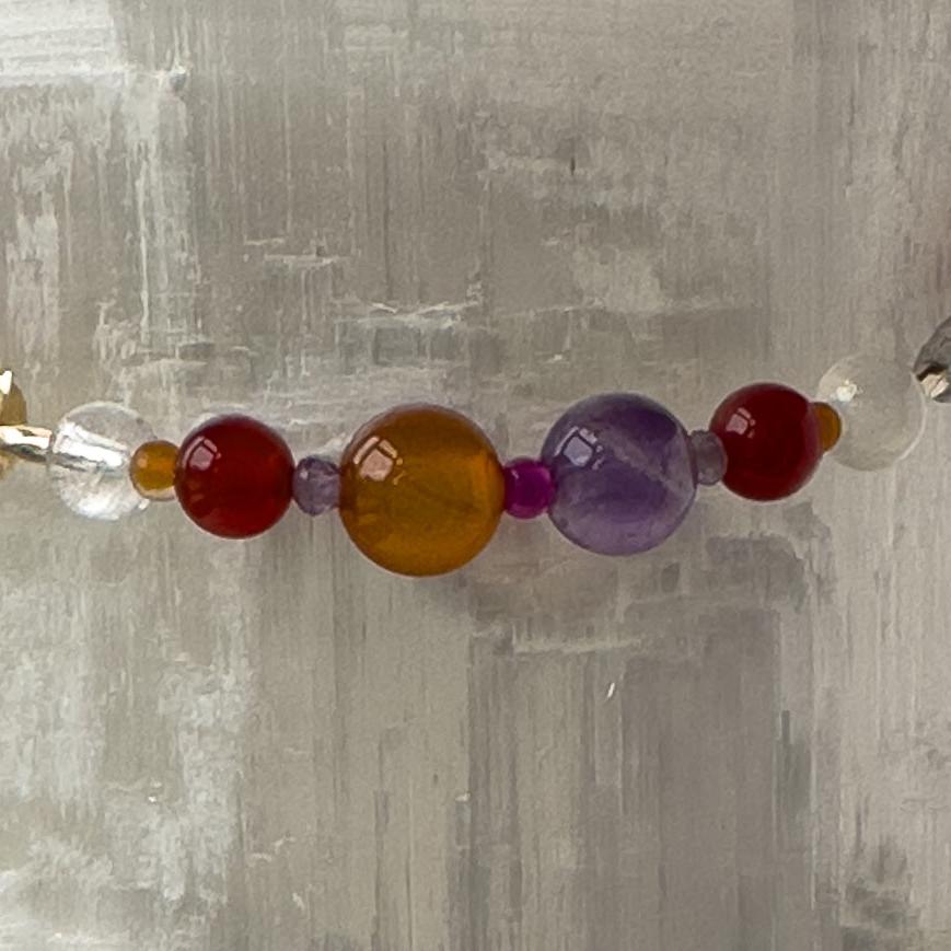 Aries birthstone Healing Crystal bracelet for Grief & Loss support showing Amethyst, Ruby, Carnelian, Selenite and Clear Quartz