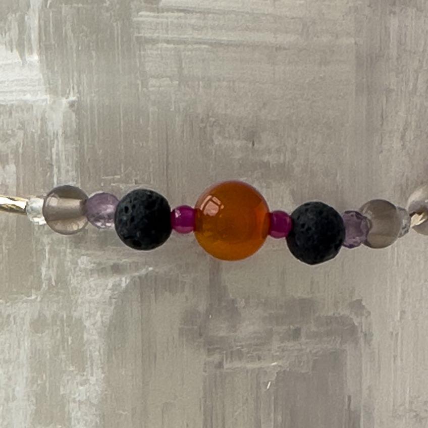 Aries Birthstone Healing Crystal bracelet for Grief & Loss support showing Amethyst, Ruby, Carnelian and Lava Stone