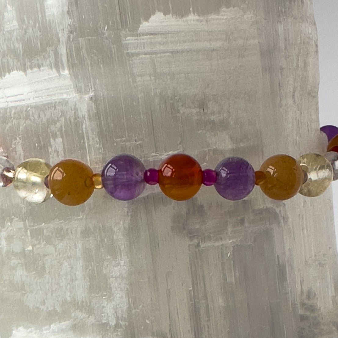 Aries Birthstone Healing Crystal bracelet for Grief & Loss support showing Amethyst, Ruby, Citrine and Carnelian
