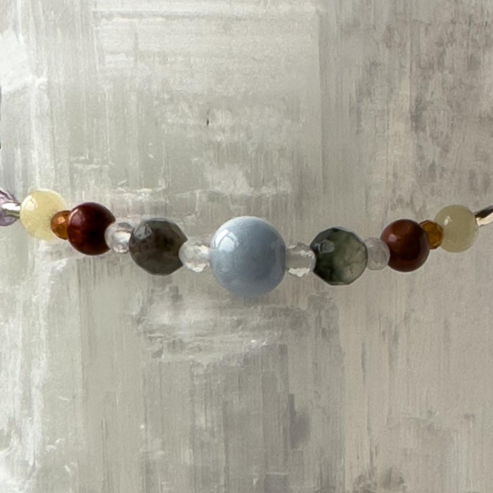 Aries Birthstone Healing Crystal bracelet for Calm & Stress relief showing Aquamarine, Bloodstone, Red Jasper, Aragonite, Garnet and Clear Quartz