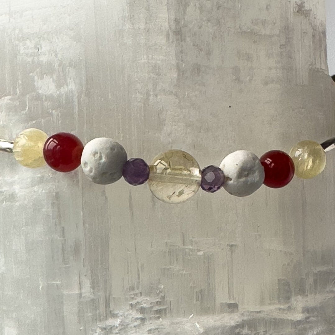 Aries Birthstone Healing Crystal bracelet for Determination & Willpower Close-up of Amethyst, Aragonite, Citrine, Carnelian and Lava Stone