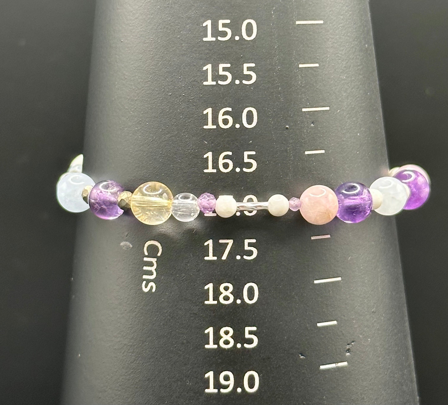 Close-up of Aries Healing Crystal bracelet for calm and anxiety relief on a  bracelet mandrel showing size of 17cm