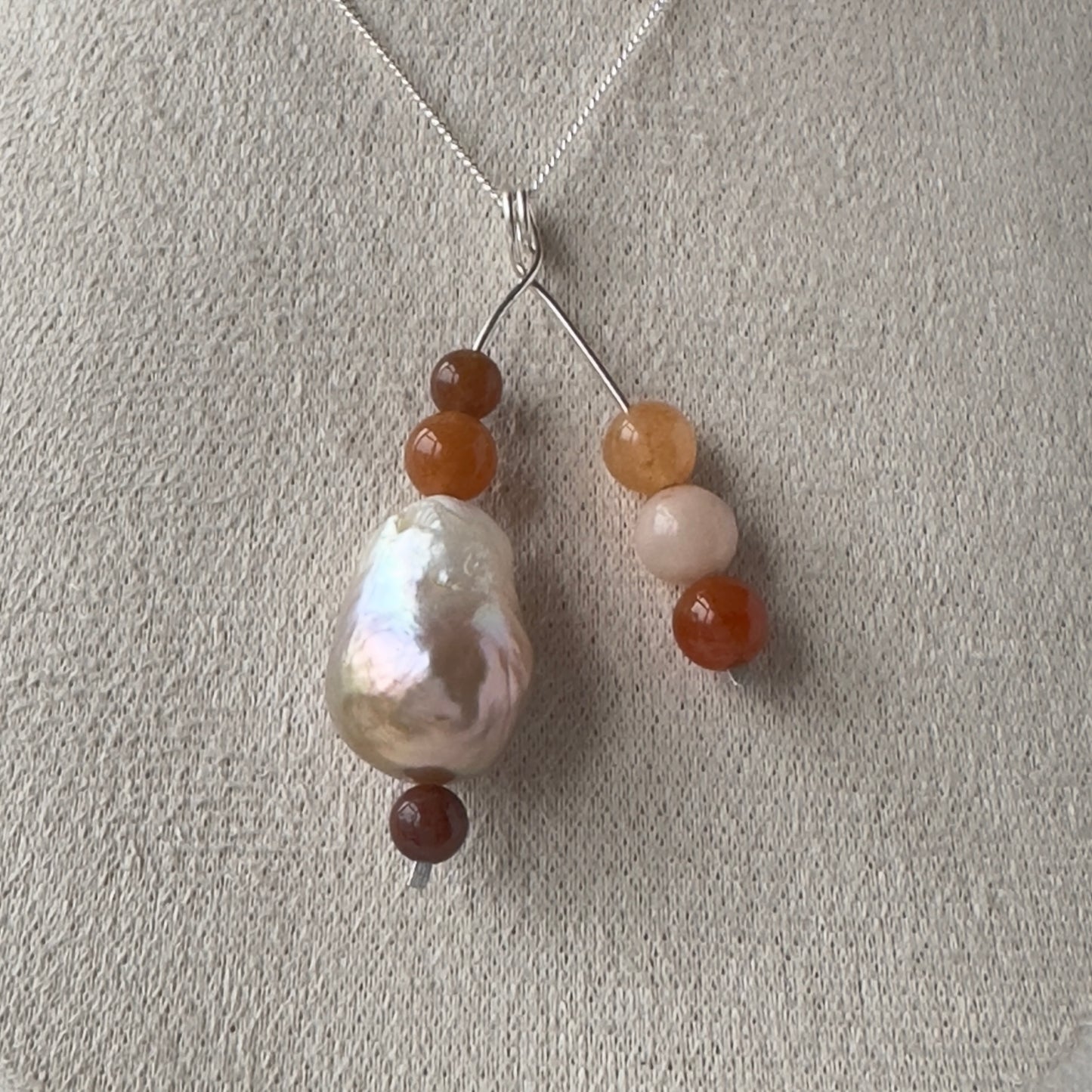 Necklace with beads on a light gray background