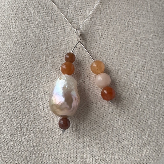 Necklace with beads on a light gray background