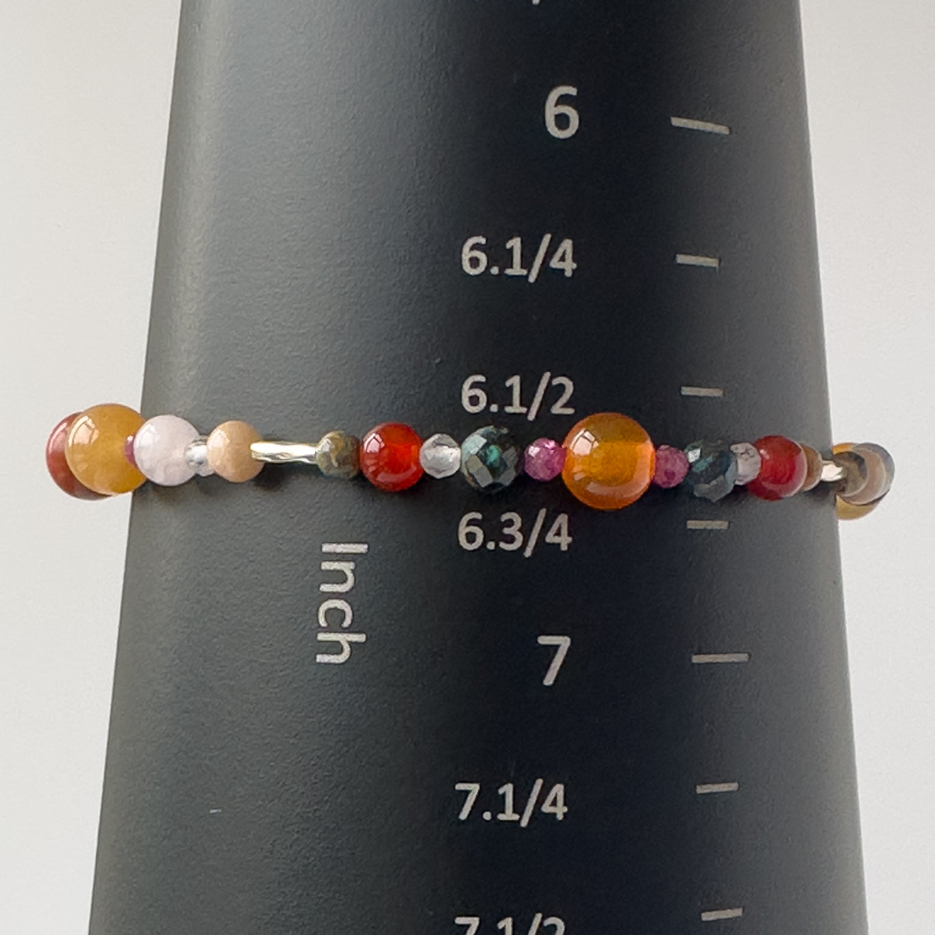 Cancer Birthstone Healing Crystal bracelet for Determination & Willpower on mandrel showing size as 6.5 inches
