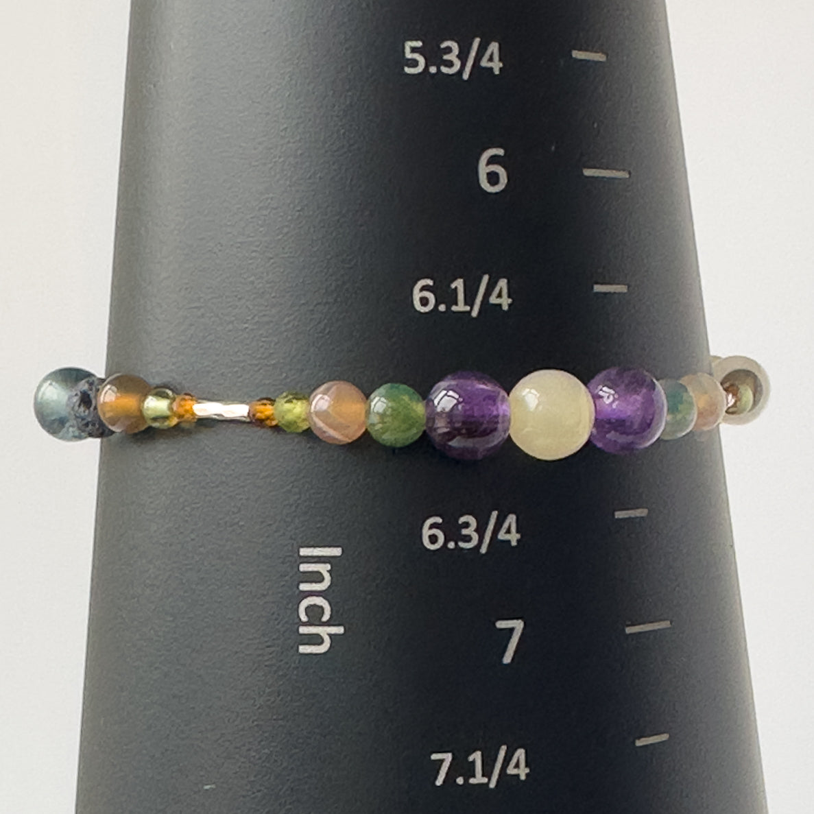 Capricorn Birthstone Healing Crystal bracelet for Determination & Willpower on mandrel showing size a 6.5 inches