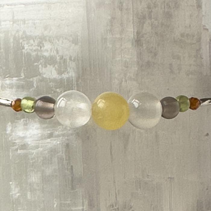 Capricorn Birthstone Healing Crystal bracelet for Determination & Willpower showing Garnet, Peridot, Smoky Quartz, Aragonite and Selenite