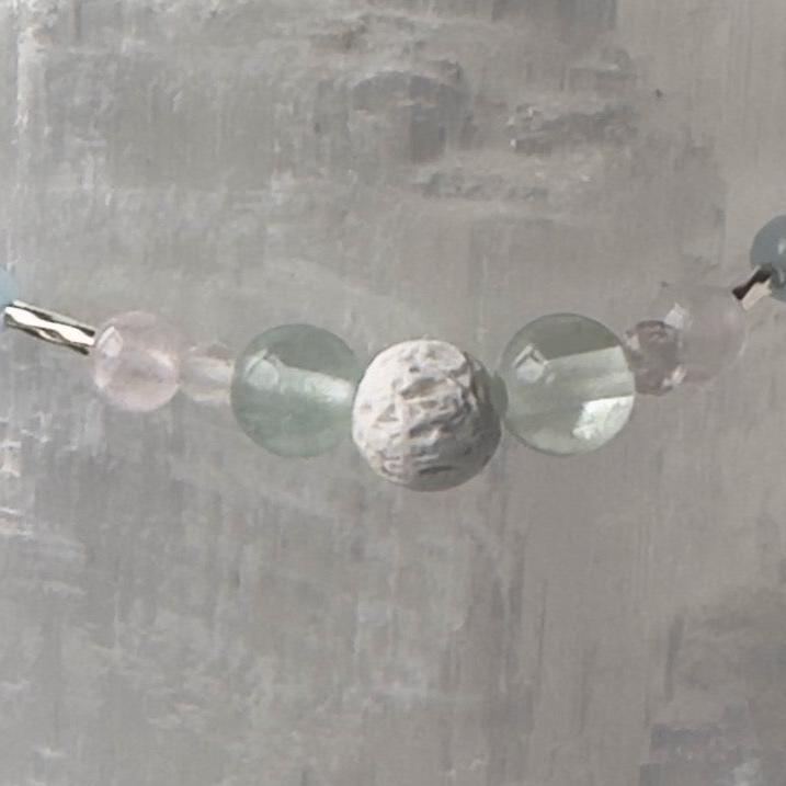 Aquarius Healing Crystal bracelet for Anxiety Close up showing Fluorite, Rose Quartz and Lava Stone                       