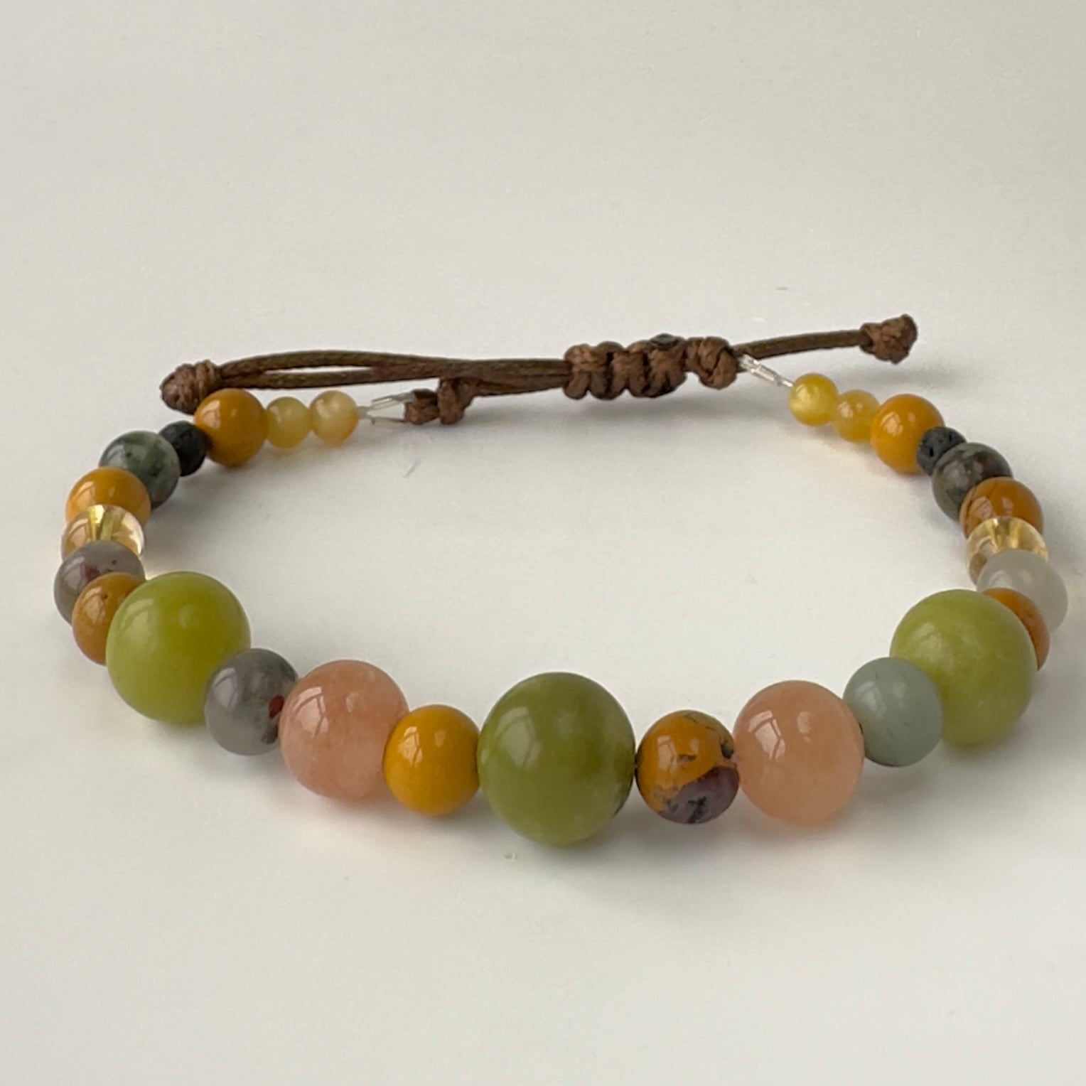 Beaded bracelet with multicolored beads on a white background